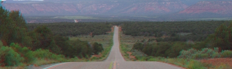 Photo of Bears Ears, visible beyond a highway.